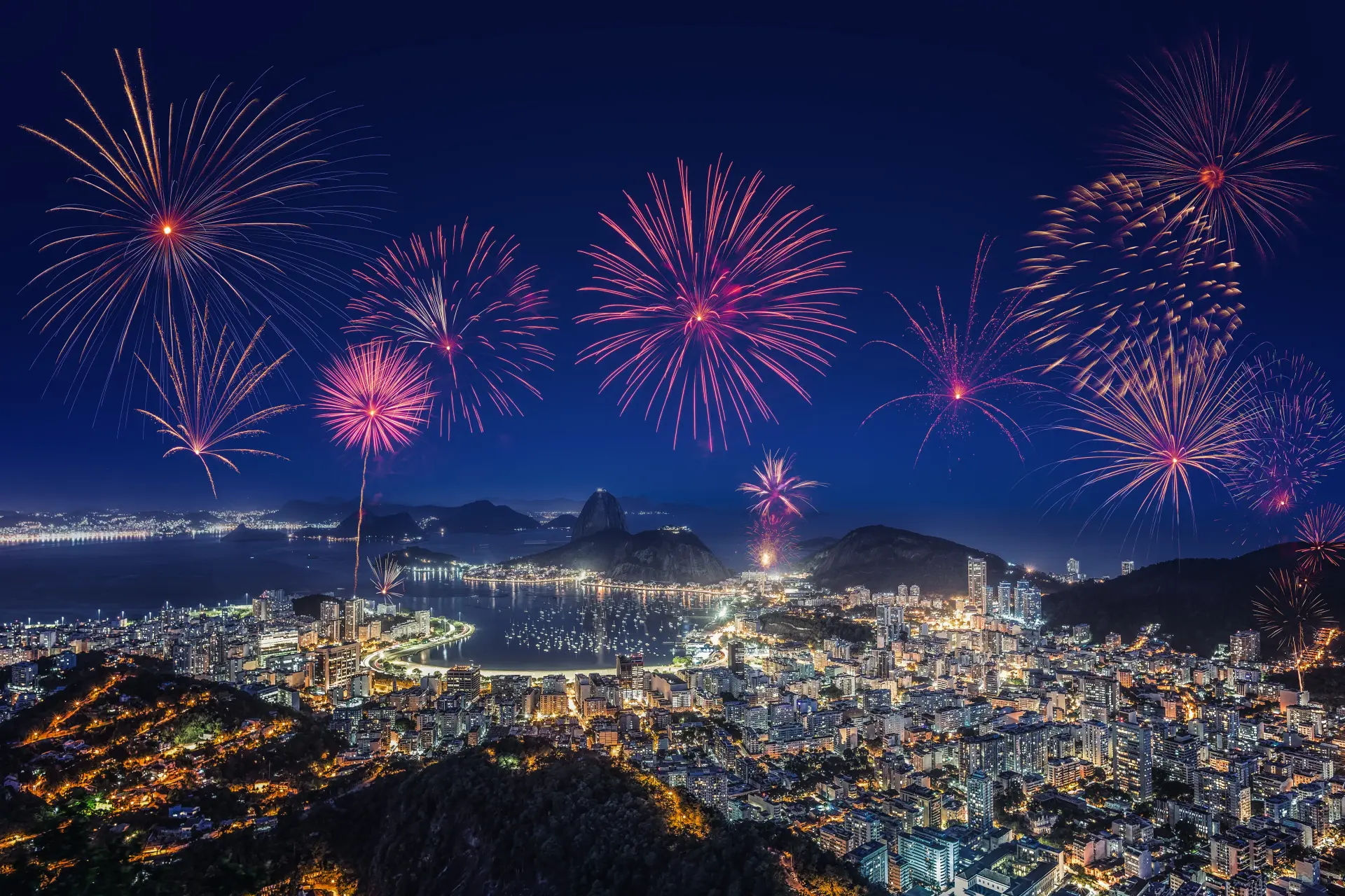 Copacabana at nightfall on the last day of the year — white dresses walking toward the sand before the fireworks